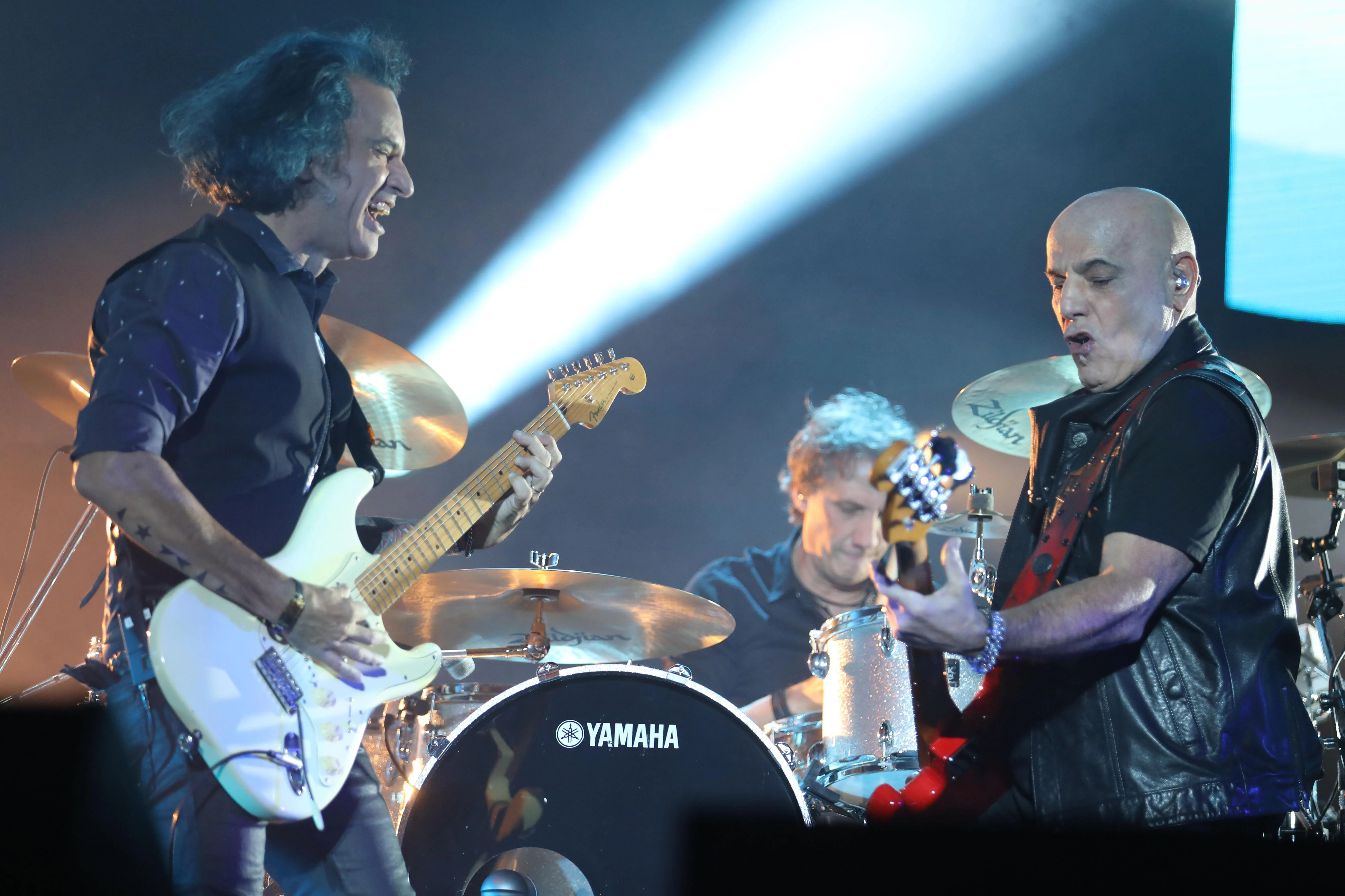 Soda Stereo performing live on stage